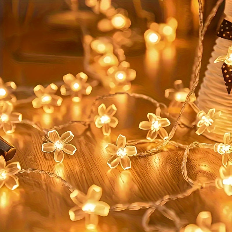 Cherry blossom string lights glowing in a tabletop arrangement.