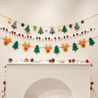 Christmas banner garland set with patterned trees, reindeer and pom poms.