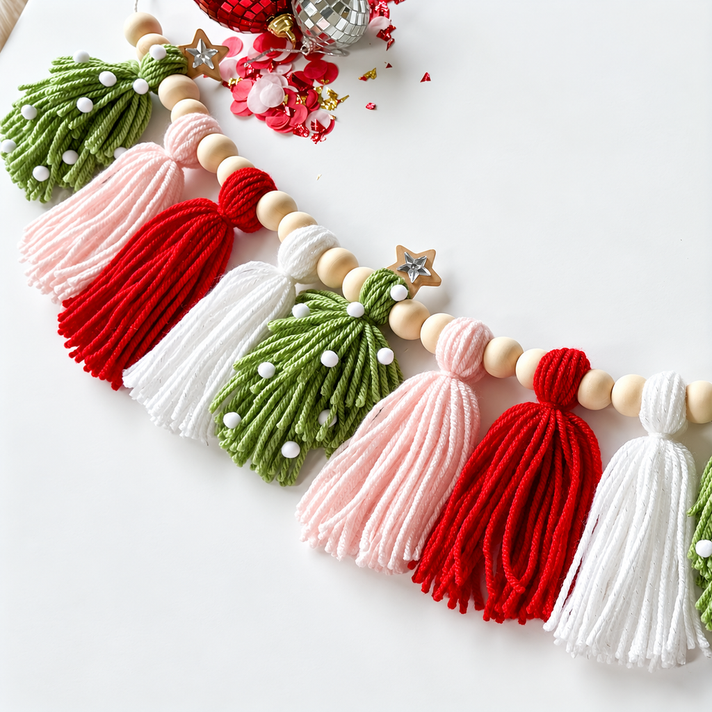 Christmas tassel garland showing yarn texture, beads and green tree-shaped tassels.