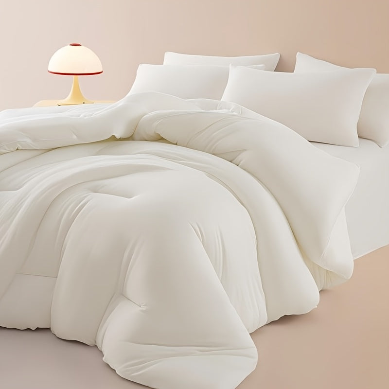 White cloud soft quilted comforter on a styled bed