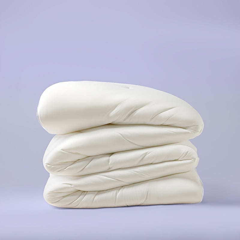 White quilted comforter folded to show its loft