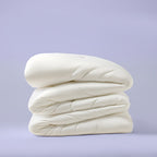 White quilted comforter folded to show its loft