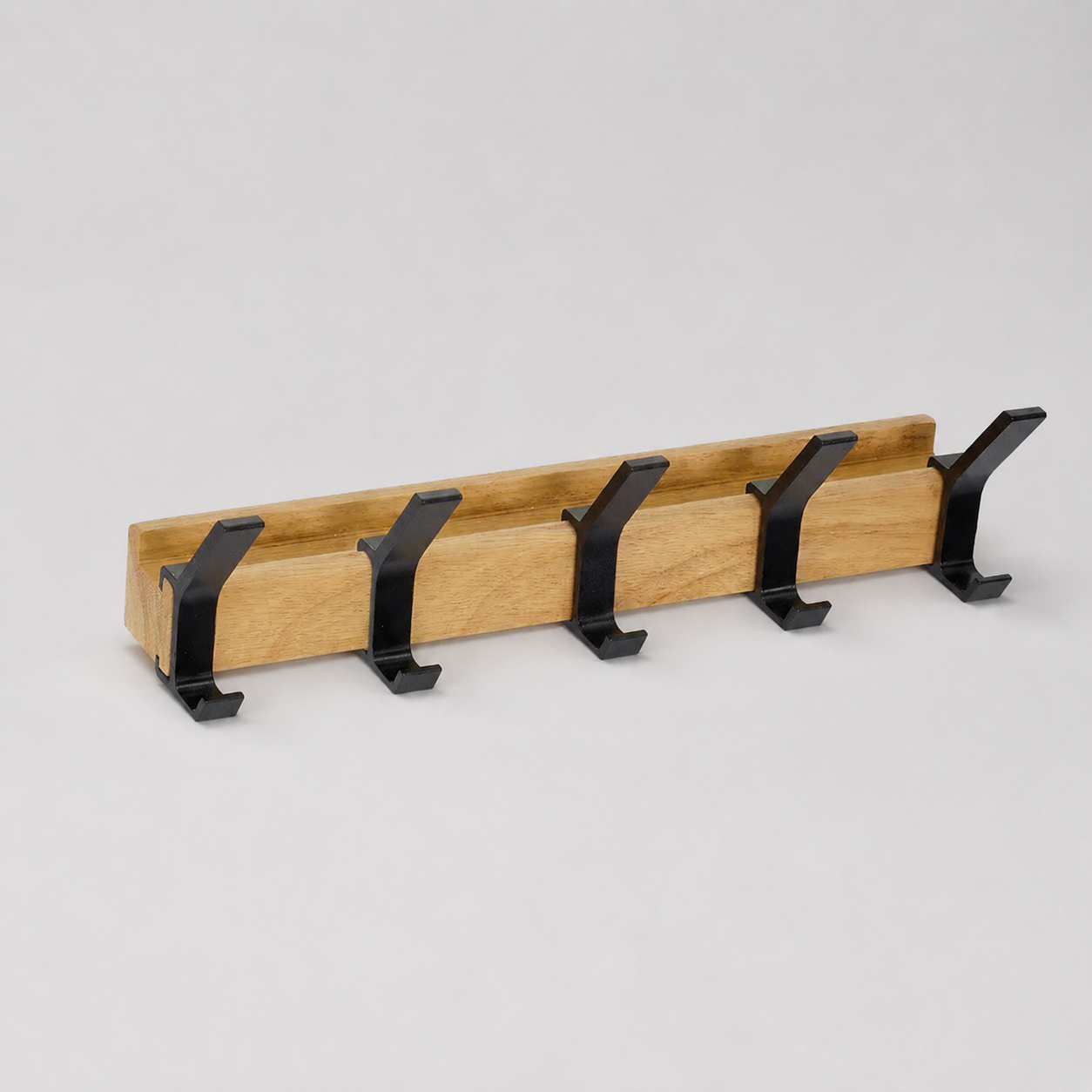 Five-hook black and wood coat rack isolated on a light gray background.