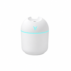 White rounded humidifier with a pale aqua light ring on a white background