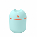 Pale blue rounded humidifier with an orange light ring on a white background