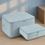 two blue compression storage bags shown in large and compact sizes