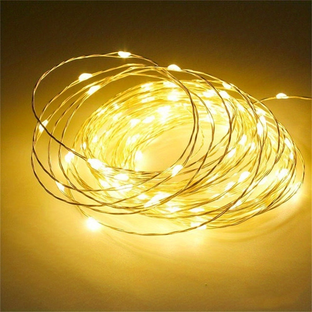 Copper fairy lights form a glowing warm white coil.