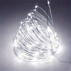 Copper fairy lights form a glowing white coil.