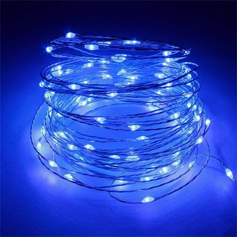 Copper fairy lights form a glowing blue coil.