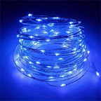 Copper fairy lights form a glowing blue coil.