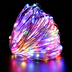 Multicolor copper wire fairy lights illuminated in a close-up coil.
