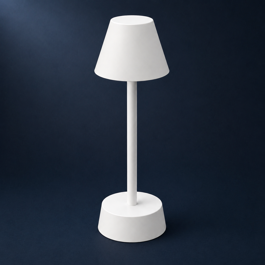 White cordless table lamp on a deep navy seamless background