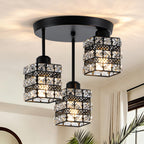 Black ceiling light with three crystal lattice shades in a bright interior