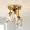 Gold three shade crystal ceiling light with staggered cylindrical shades