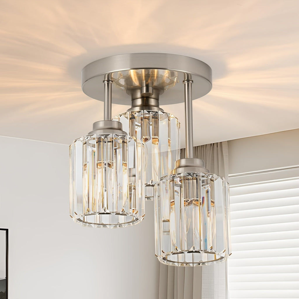 Silver three shade crystal ceiling light in a bright room