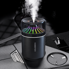 Black cup humidifier with multicolor radial lighting on a car console