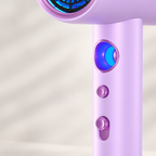 Purple hair dryer showing the round control and lower switches