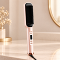 Champagne electric straightening brush with a rectangular black comb head