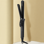 Black hinged curling iron in its original upright alcove setting