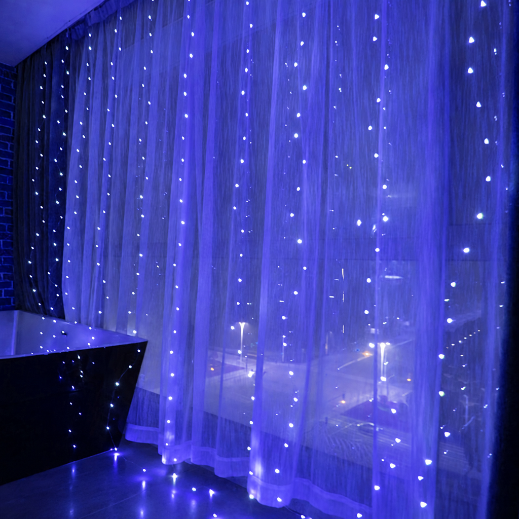 Blue curtain fairy lights glowing across sheer window curtains.