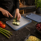 Double sided board highlighting its juice groove and non-slip edge.