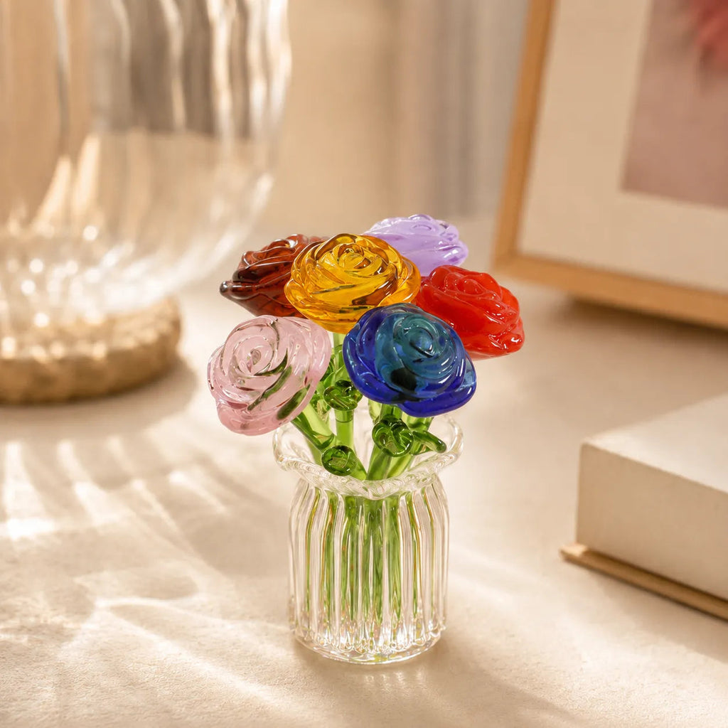 Miniature decorative glass flowers in a vase, roses