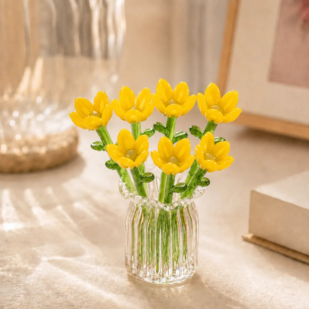 Miniature decorative glass flowers in a vase, yellow flowers