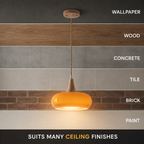 Orange pendant light displayed against several labeled ceiling finishes from light to dark.