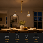 Brass two head pendant light glowing above a dining table with four feature icons below.