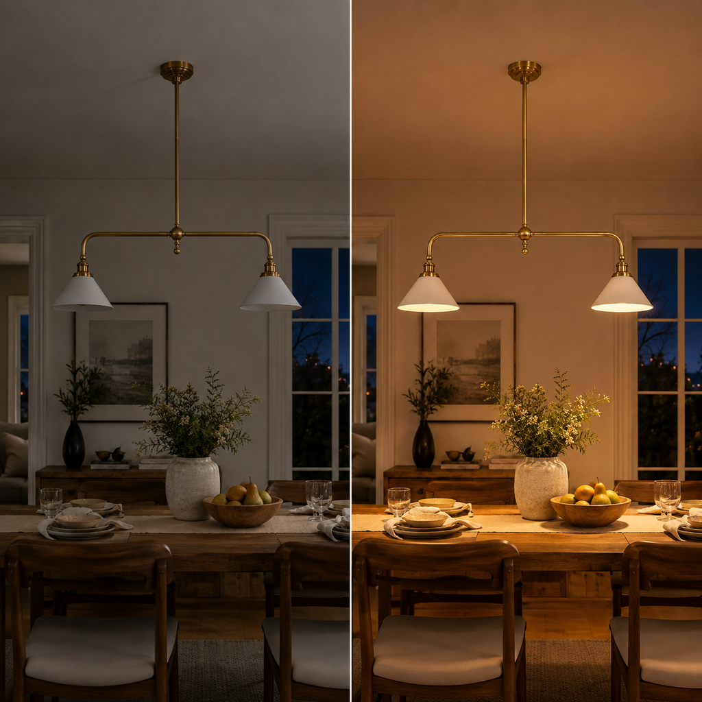 Brass two head pendant light hanging above a kitchen island in a warmly lit open-plan room.