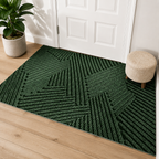 Green geometric door mat displayed in a bright American entryway before a white paneled door.