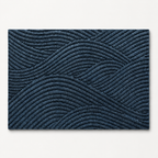 Blue geometric door mat shown alone on a cool off white studio background.