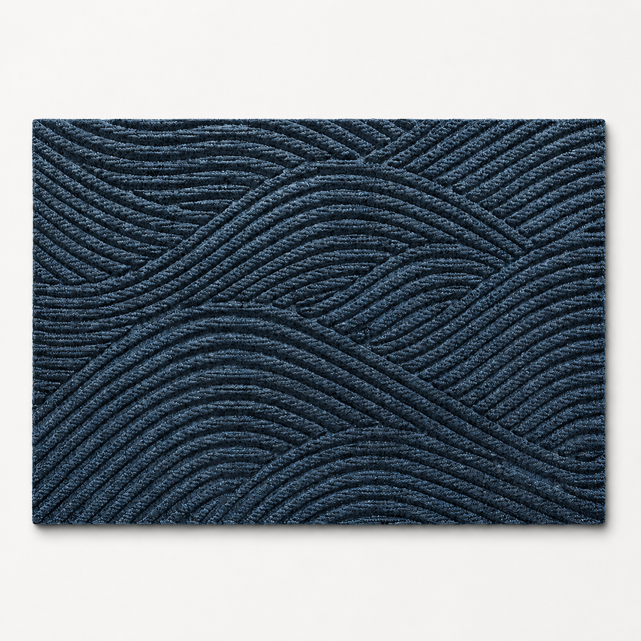 Blue geometric door mat shown alone on a cool off white studio background.