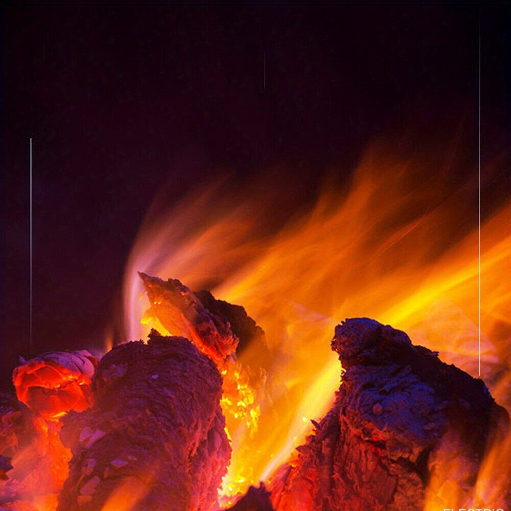 Electric fireplace heater closeup of the illuminated log and flame effect.