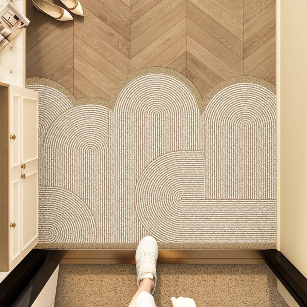 Entry mat with a beige abstract line print placed across a doorway.