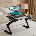 Black adjustable laptop stand with folding legs and side tray