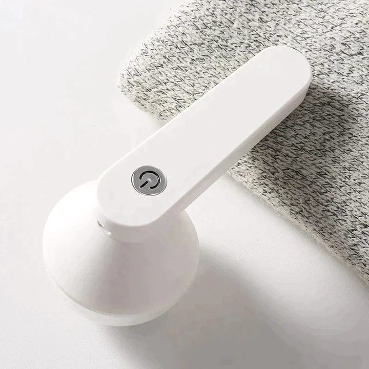 White fabric shaver with a power button on folded material