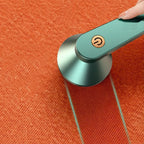 Green fabric shaver shown over orange fabric with a comparison effect