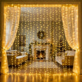 Warm white fairy curtain lights draped across a living room window.