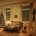 Fairy curtain lights spanning a festive living room window beside a Christmas tree.