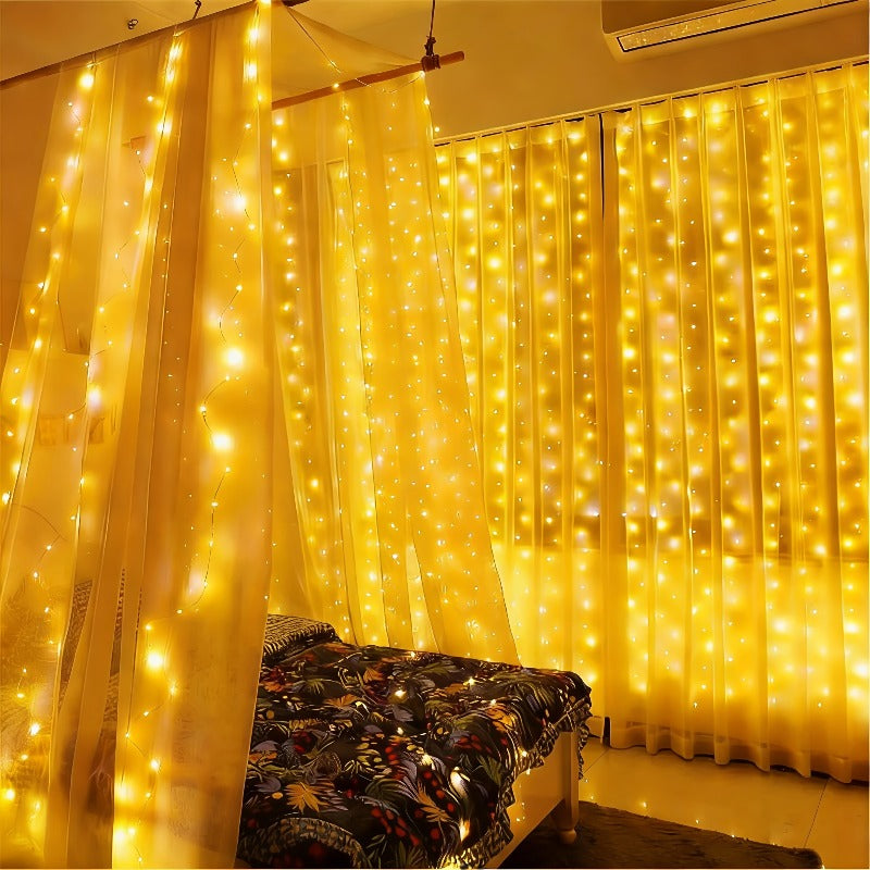 Fairy curtain lights glowing behind sheer curtains beside a bedroom chair.