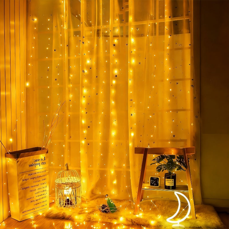 Fairy curtain lights hanging beside a chair and decorative lantern.