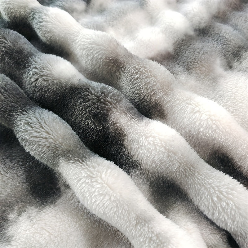 Close view of raised gray and white rows on the faux fur throw blanket.