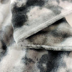 Folded edge showing both plush sides of the faux fur throw blanket.