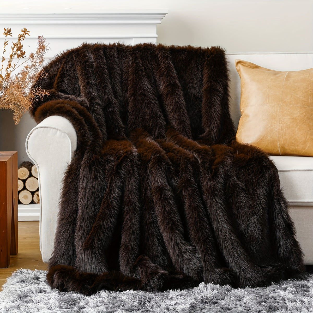 Dark brown faux fur throw blanket covering a white armchair.
