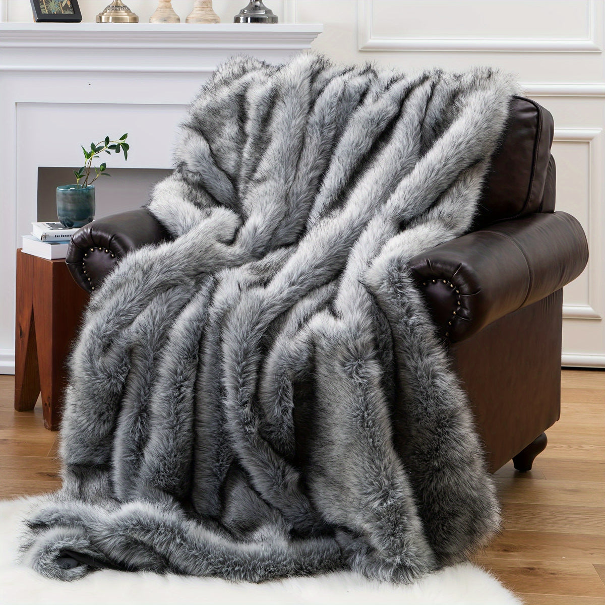 Gray faux fur throw blanket covering a brown armchair.