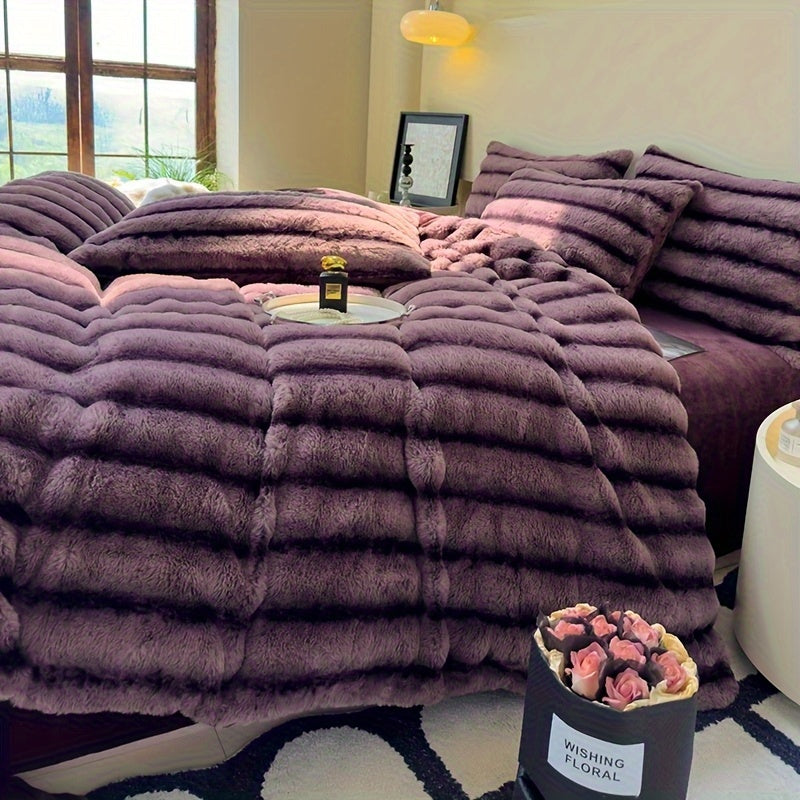 Purple faux fur throw blanket draped across a bed.