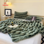 Green faux fur throw blanket on a bed with a single blanket label.