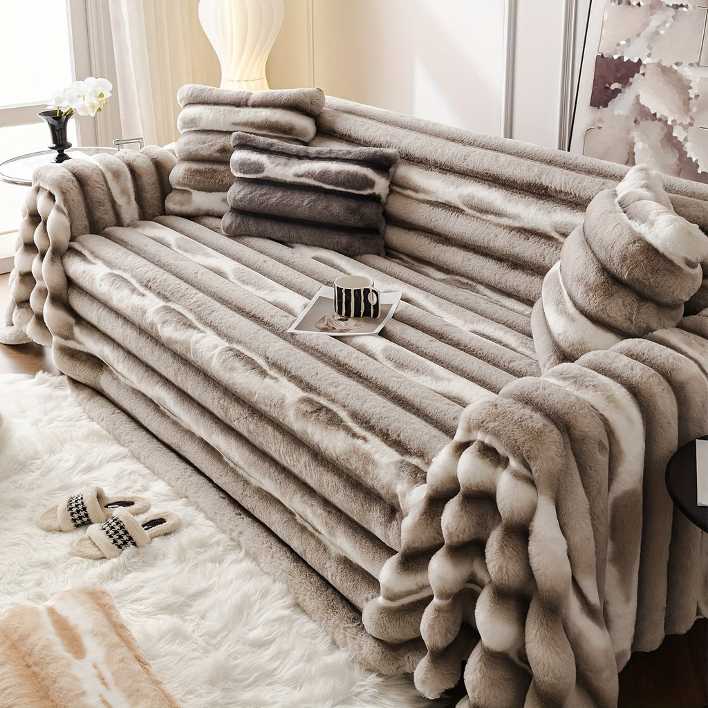 Light brown ribbed sofa cover with a cream rug and white coffee table.