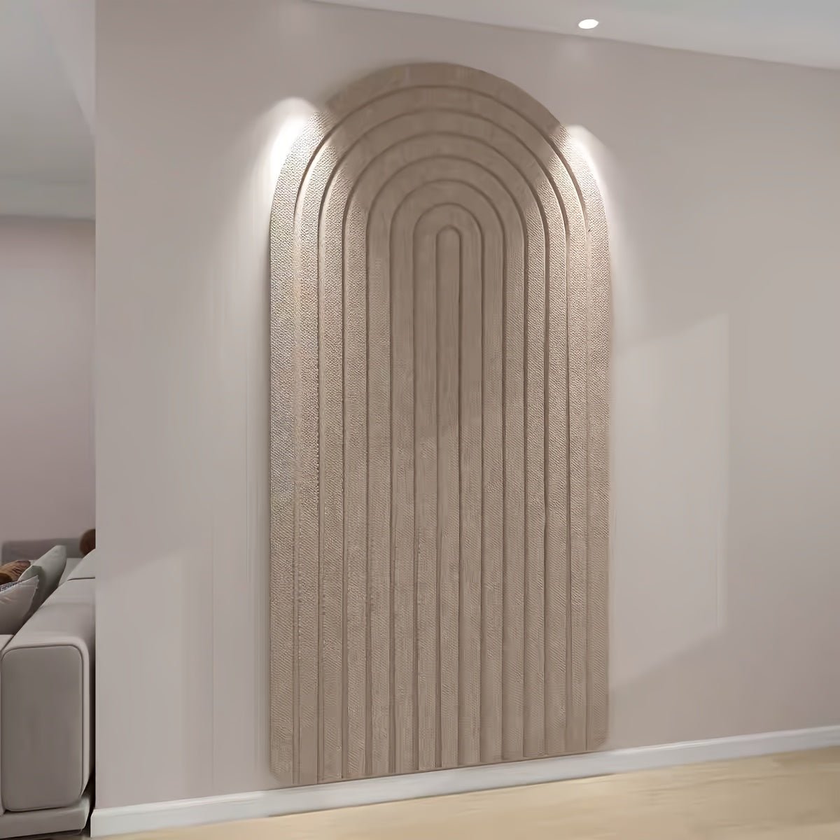 Felt pinboard in camel with a tall arched striped design on a living room wall.
